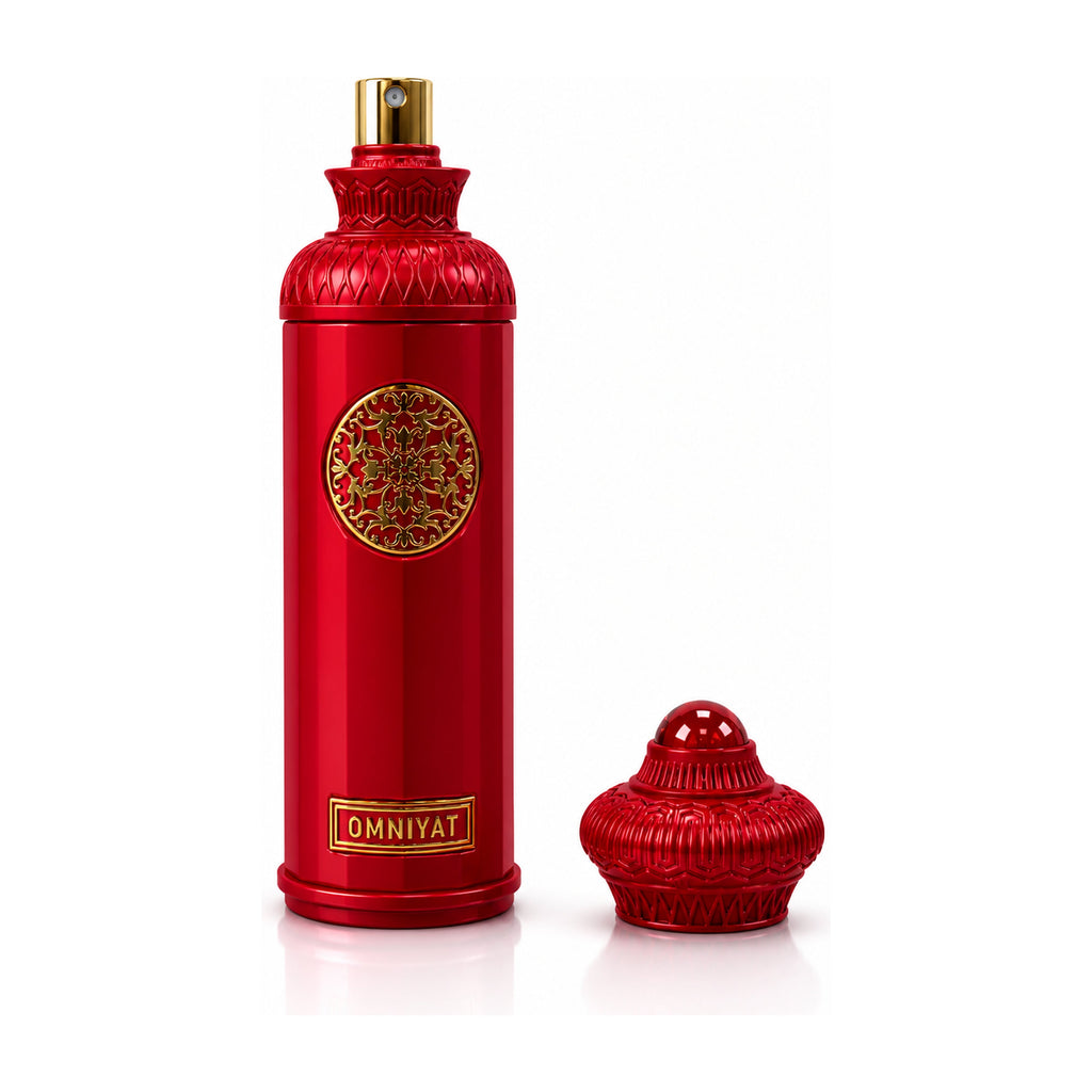 Red perfume bottle with intricate design and gold accents on a white background