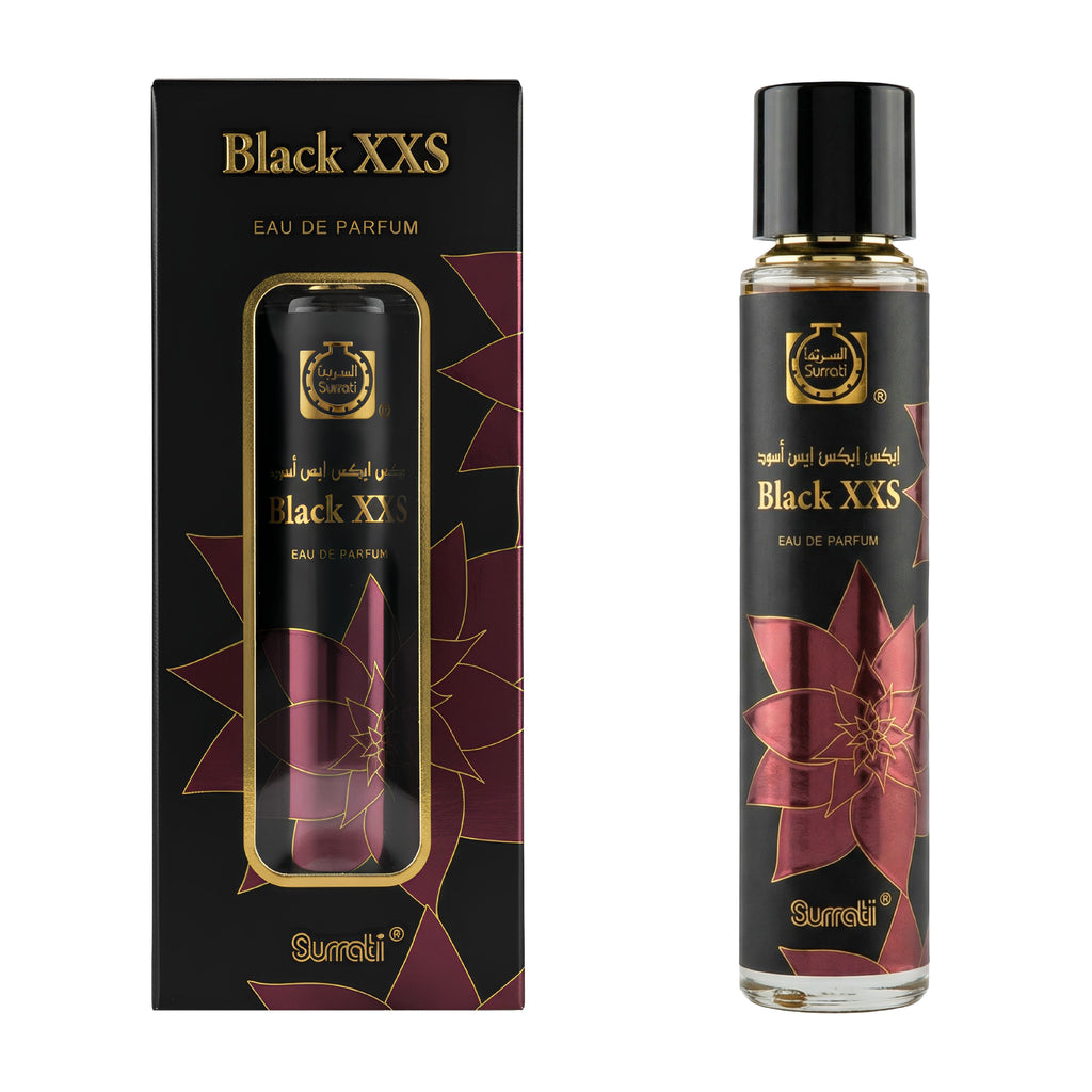 A bottle of Surati Black XXS Eau de Parfum next to its black packaging box, both decorated with gold lettering and a dark red floral pattern, on a plain white background.
