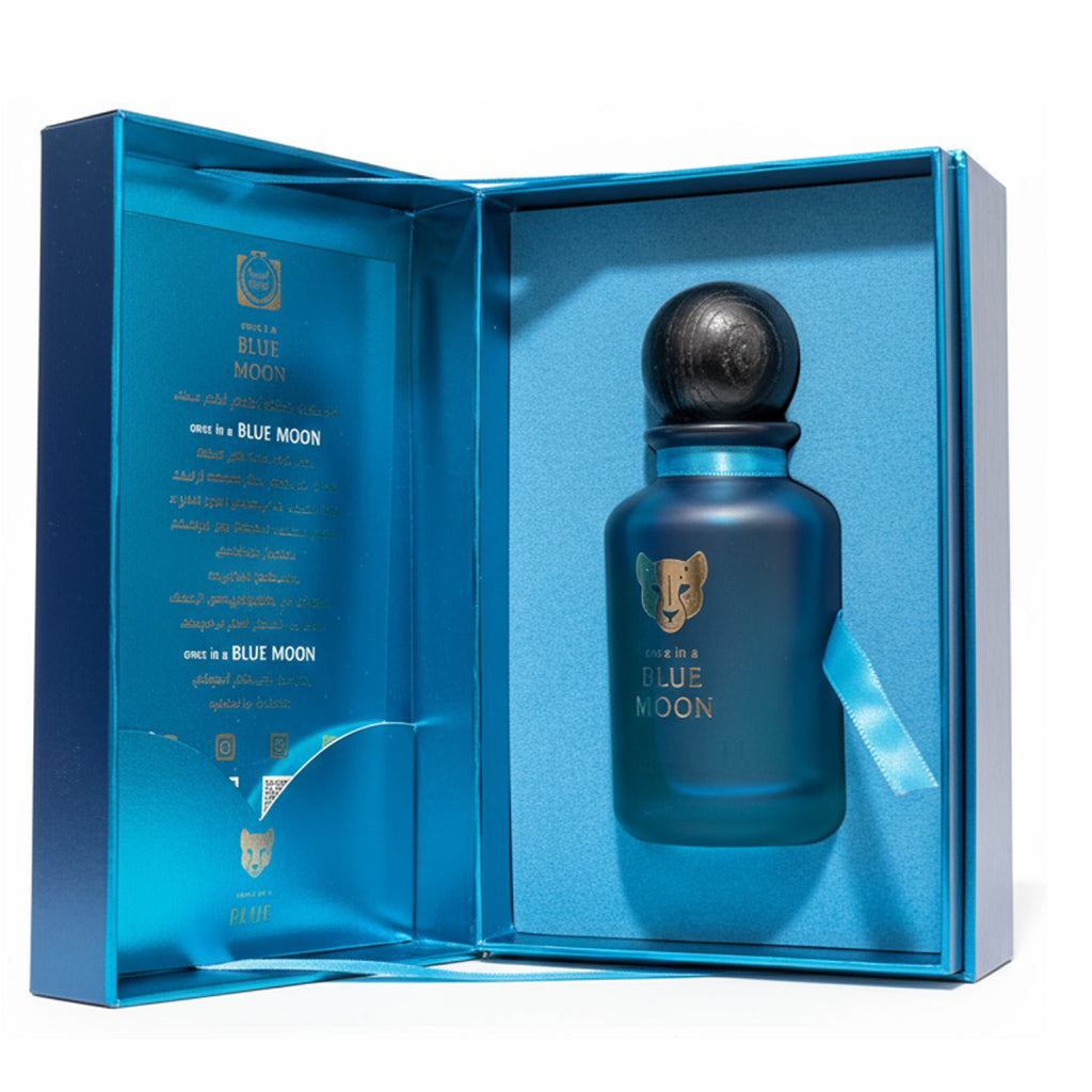 Blue Moon perfume bottle in a blue box on a white background