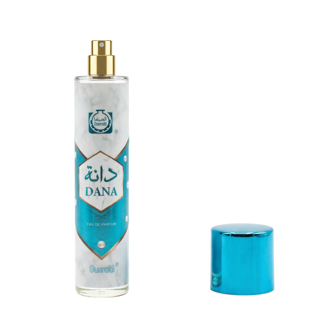 A bottle of Dana Eau de Parfum with a gold spray nozzle and a separate metallic blue cap, displayed on a clean white background.