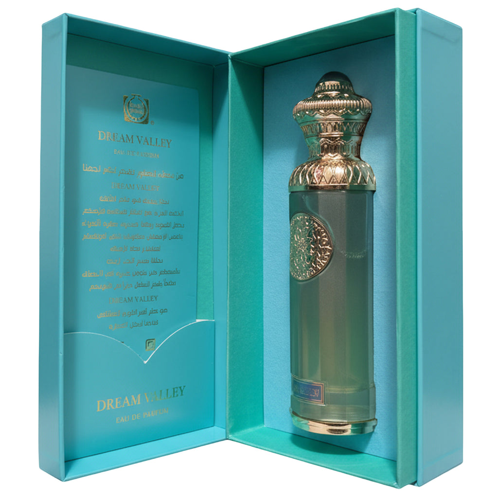 Perfume bottle with decorative cap in a turquoise box, featuring 'Dream Valley' branding.