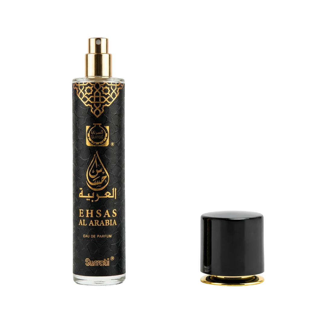 A bottle of Ehsas Al Arabia Eau de Parfum with a black textured body, gold Arabic lettering, and a gold spray nozzle, shown next to its detached black cap with a gold base on a white background.