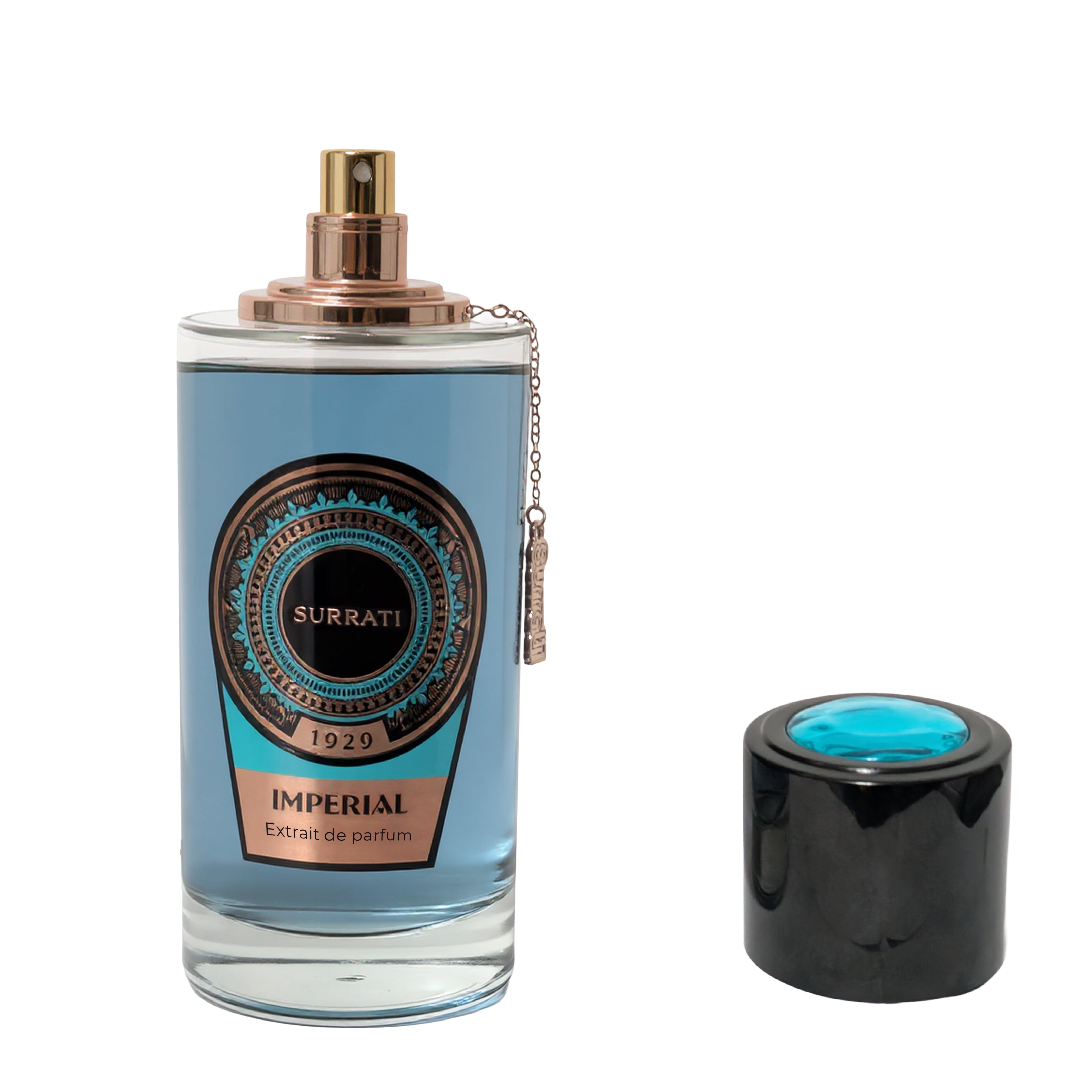 A bottle of Surratl Imperial Extrait de Parfum with a light blue liquid, a gold spray nozzle, and a black cap with a blue insert, shown on a white background.