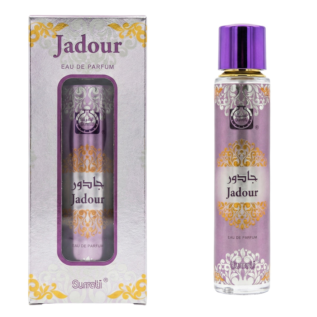 Surati Jadour Eau de Parfum bottle with a metallic purple cap next to its matching retail box, featuring purple and gold ornate designs on a white background.