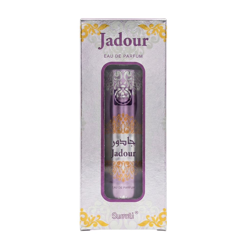 Surati Jadour Eau de Parfum bottle with a metallic purple cap next to its matching retail box, featuring purple and gold ornate designs on a white background.