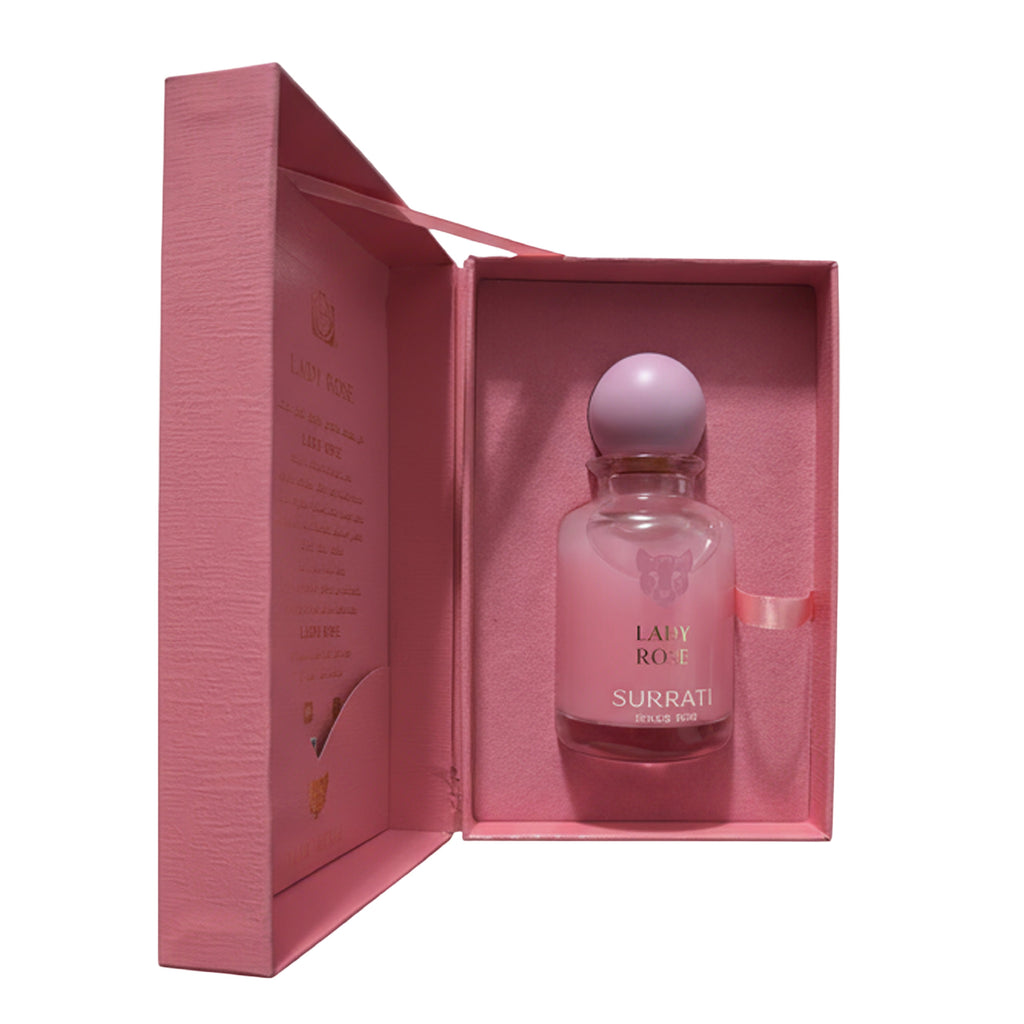 Pink Surrati perfume bottle in an open pink box on a white background