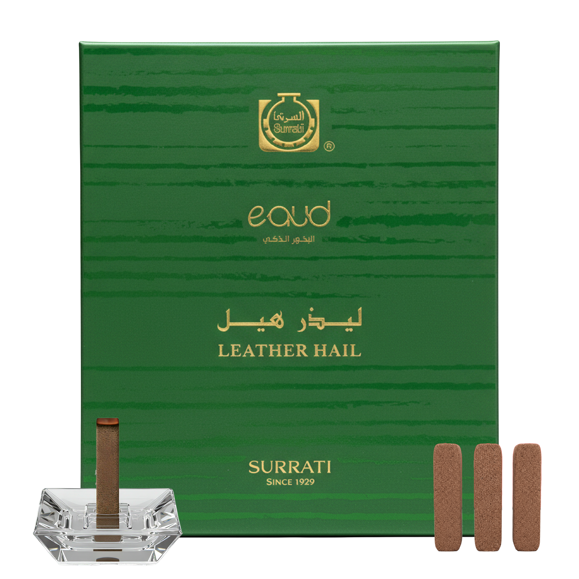 Green Surrati eau d'or box with incense sticks and a crystal holder on a white background