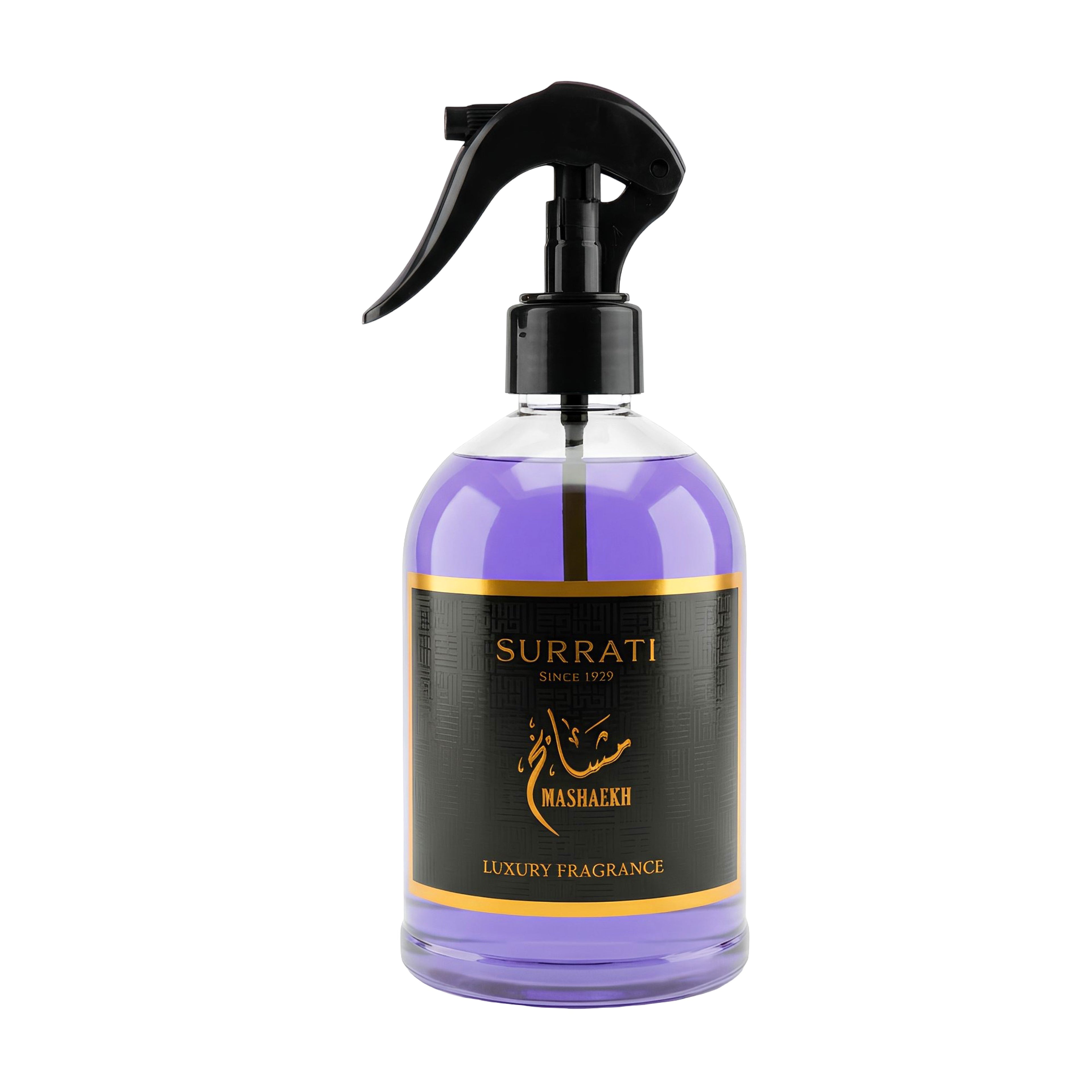 A clear glass spray bottle filled with purple fragrance liquid, featuring a black trigger sprayer and a black label with gold lettering that reads 'Surrati Since 1973 Mashakh Luxury Fragrance'.