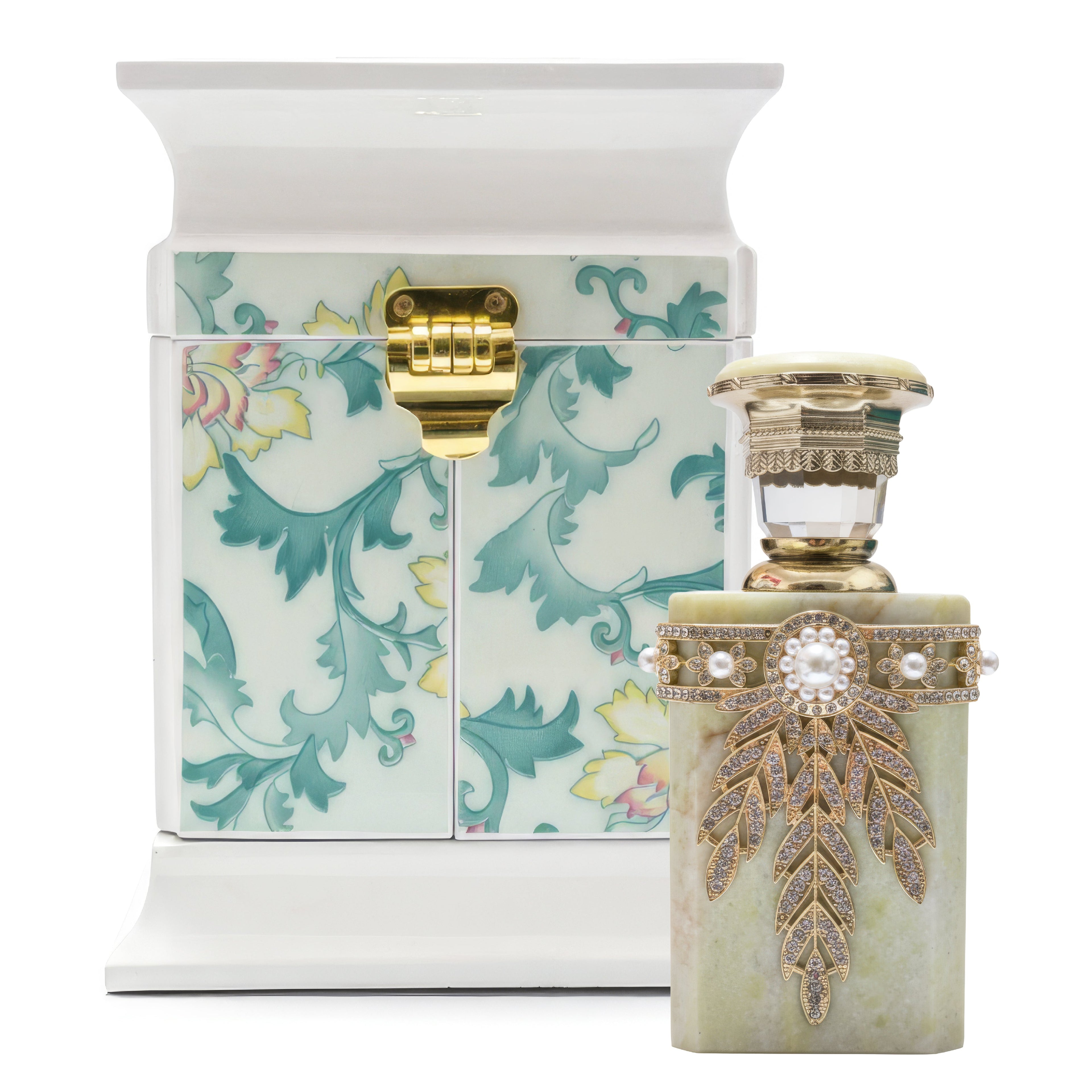 Decorative perfume bottle with intricate design and matching box on a white background