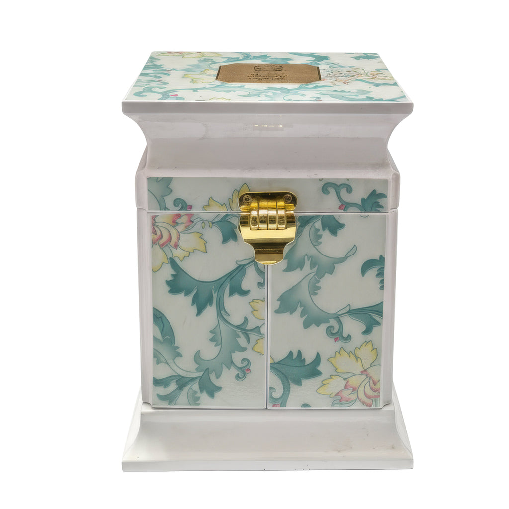 Decorative box with floral patterns and a gold latch on a white background