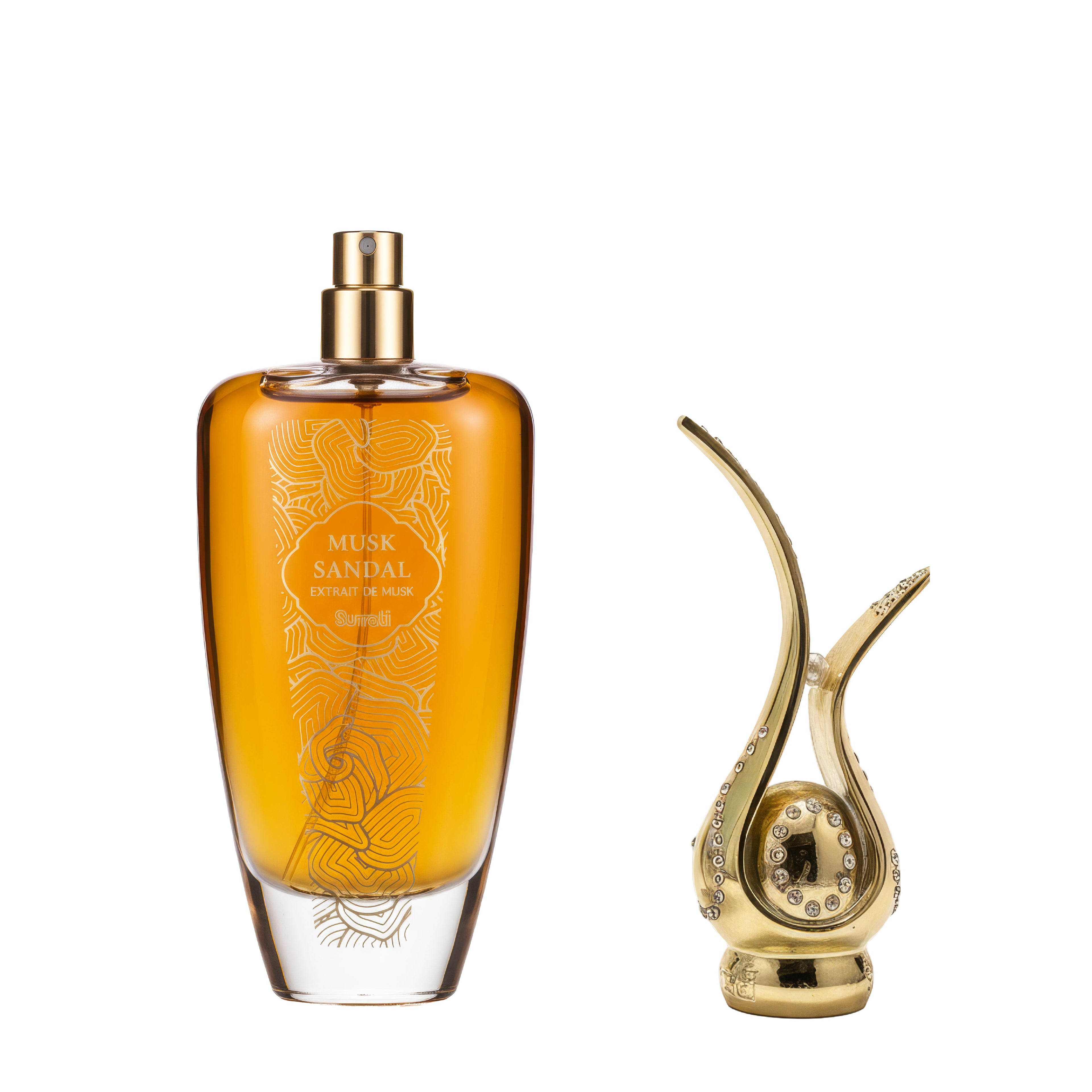 Perfume bottle with gold cap and decorative design, next to a gold and crystal object on a white background