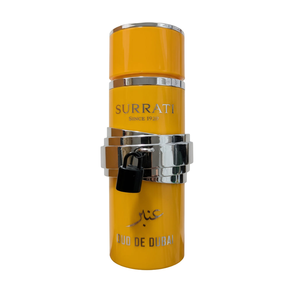 Yellow Surrati perfume bottle with silver cap on a white background