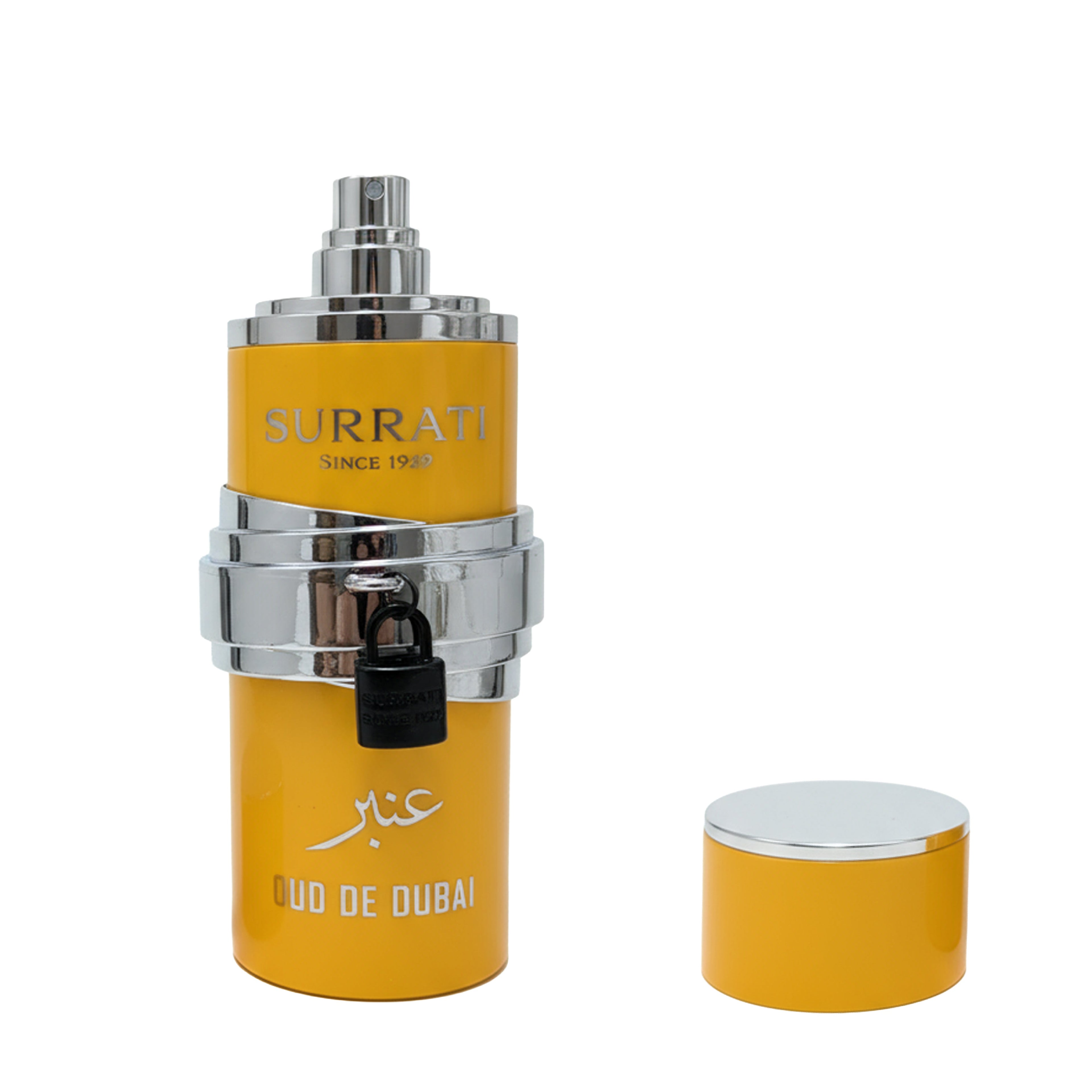 A yellow cylindrical perfume bottle with silver metallic bands and a black lock, shown next to its matching yellow cap on a plain white background. The bottle features the brand name 'Surrati' and 'Oud De Dubai'.