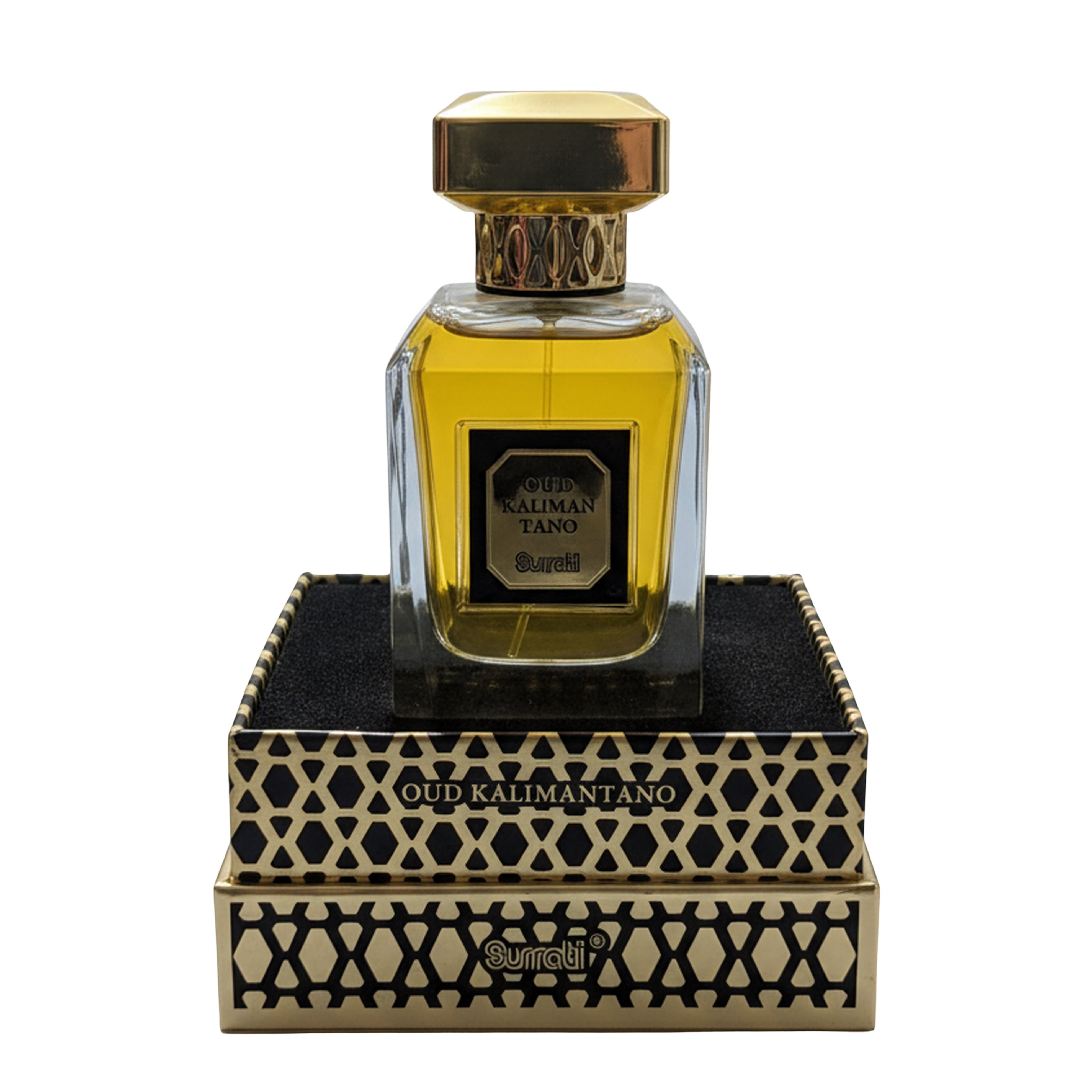 A bottle of Oud Kalmantang perfume by Gurnei, featuring a clear glass bottle filled with golden-yellow liquid and topped with a gold cap, displayed on top of its ornate black and gold patterned presentation box against a white background.