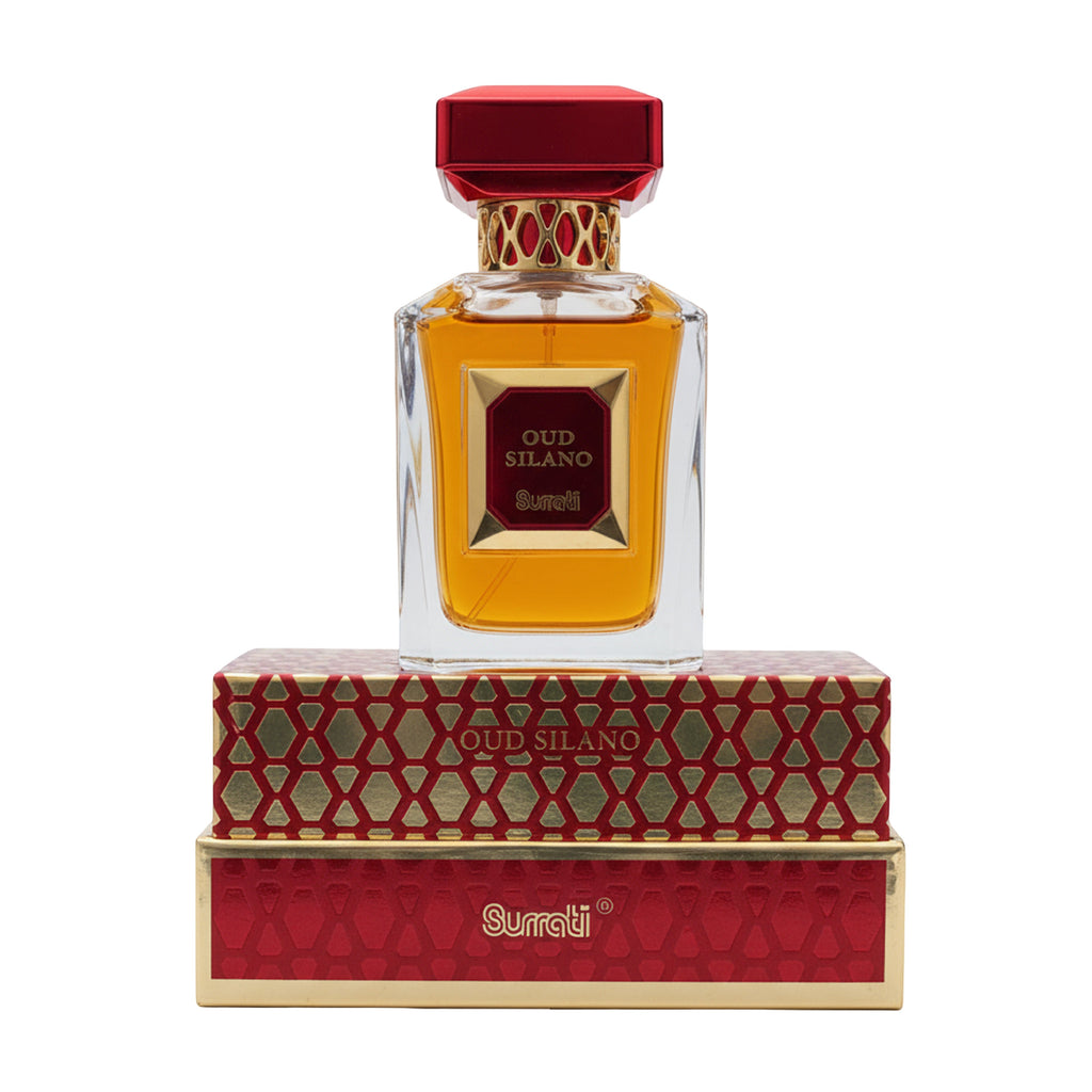 Oud Silano Surati perfume bottle with amber liquid, a red cap, and a red-and-gold patterned box, shown on a plain white background.