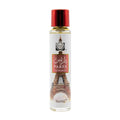 Perfume bottle with Eiffel Tower design on a white background