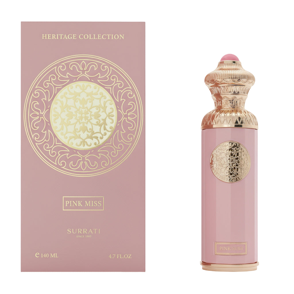 Pink Surrati perfume bottle with decorative packaging on a white background