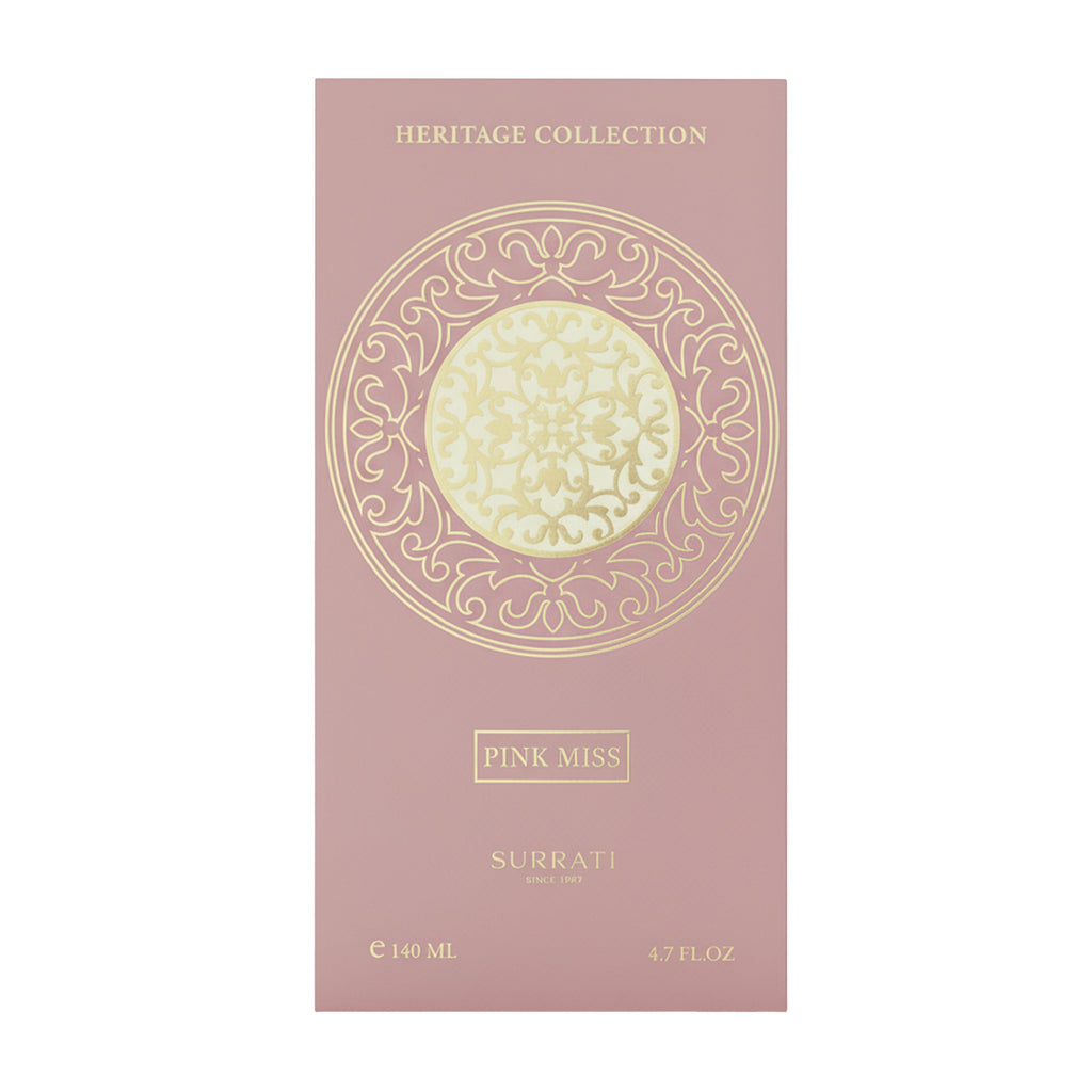 Surrati Pink Miss perfume packaging with intricate design on a pink background