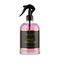 Surrati Rose Tobacco luxury fragrance spray bottle on a white background