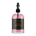 Surrati Rose Tobacco fragrance bottle with pink liquid on a white background