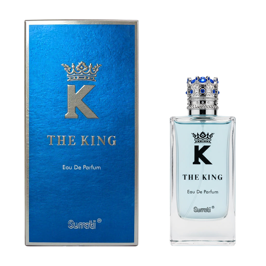 Surati The King Eau De Parfum bottle next to its blue packaging box, featuring a silver 'K' with a crown on a white background.
