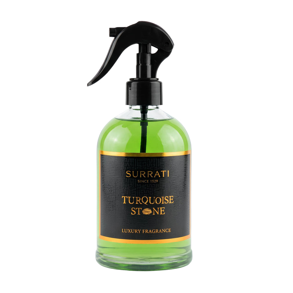Green spray bottle with black nozzle labeled 'Surrati Turquoise Stone' on a white background