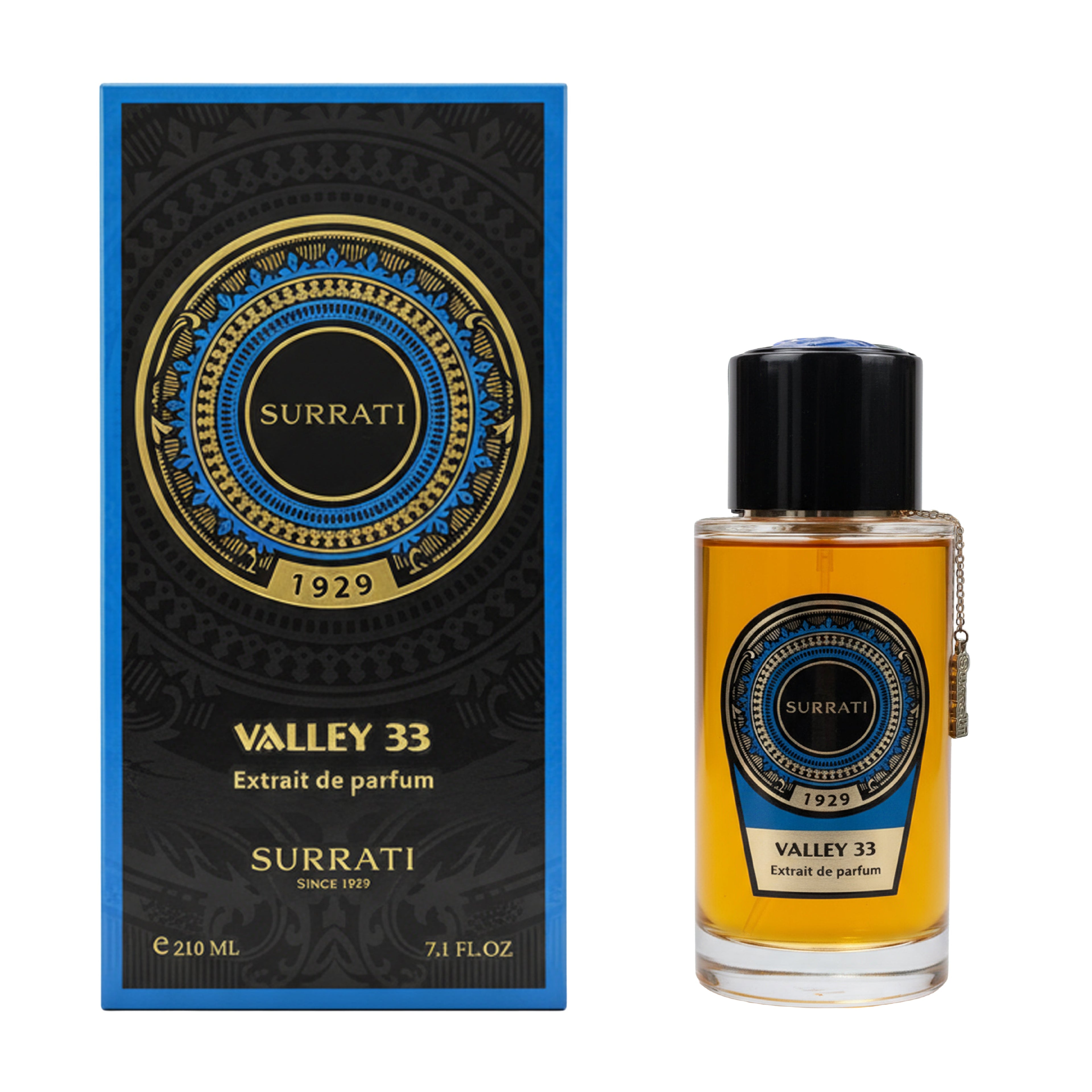 Surrati Valley 33 Extrait de Parfum shown with its black and blue packaging box and the clear glass perfume bottle containing amber liquid, on a white background.