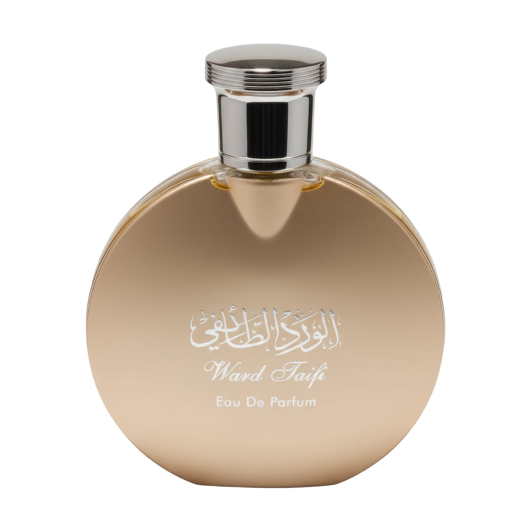 Gold perfume bottle with silver cap on a white background
